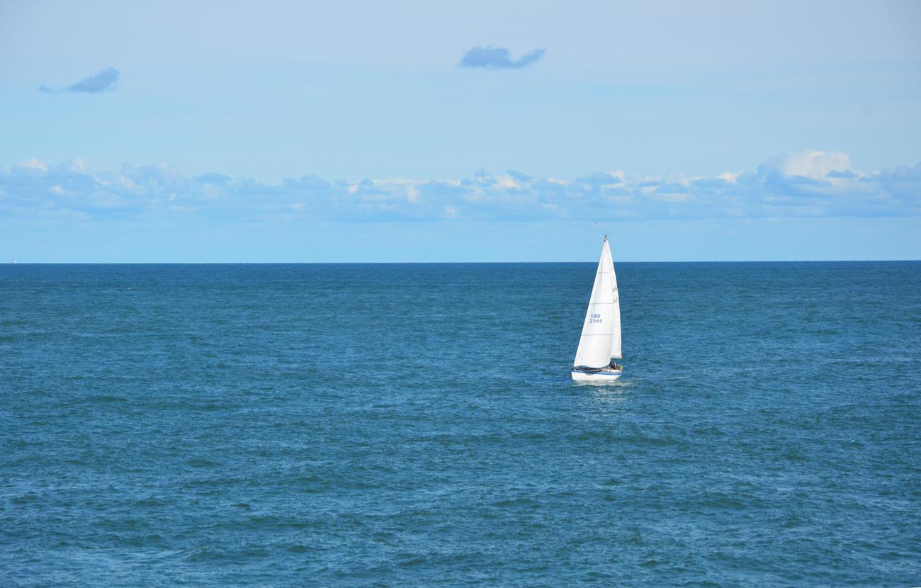 how do sailboats sail into the wind